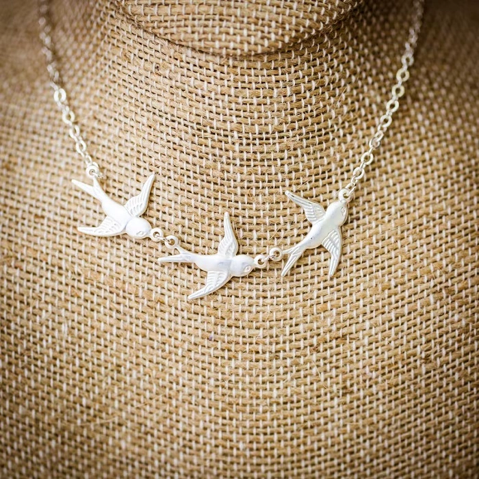 Three Little Birds Necklace: A Symbol of Hope and Freedom three little birds necklace